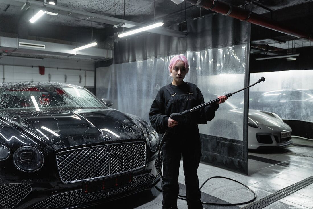 Bentley being detailed in the AquaShine professional washing bay